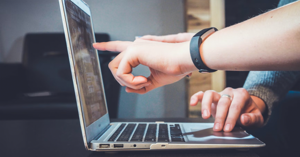 pointing at computer